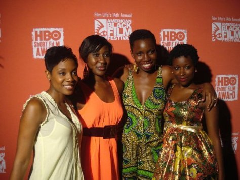 Ellie Foumbi en robe Orange